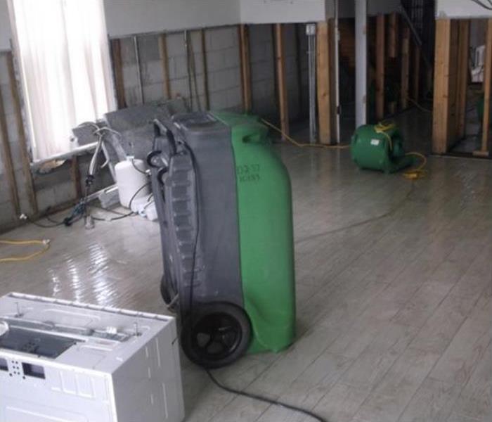 SERVPRO drying equipment setup in the office to dry the water